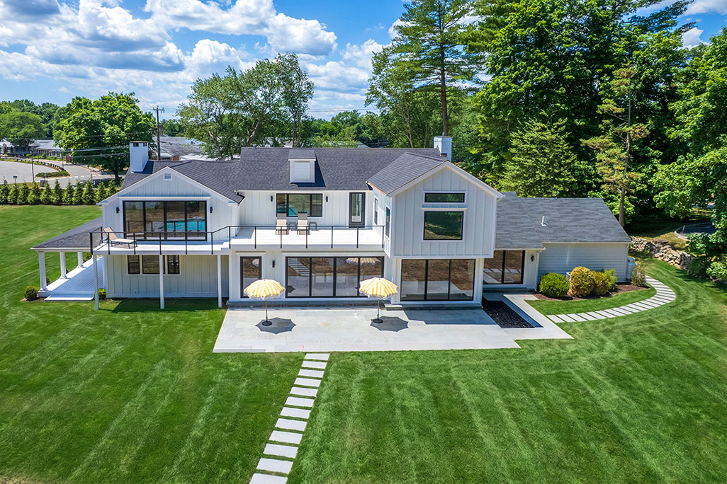 Modern white house with backyard patio